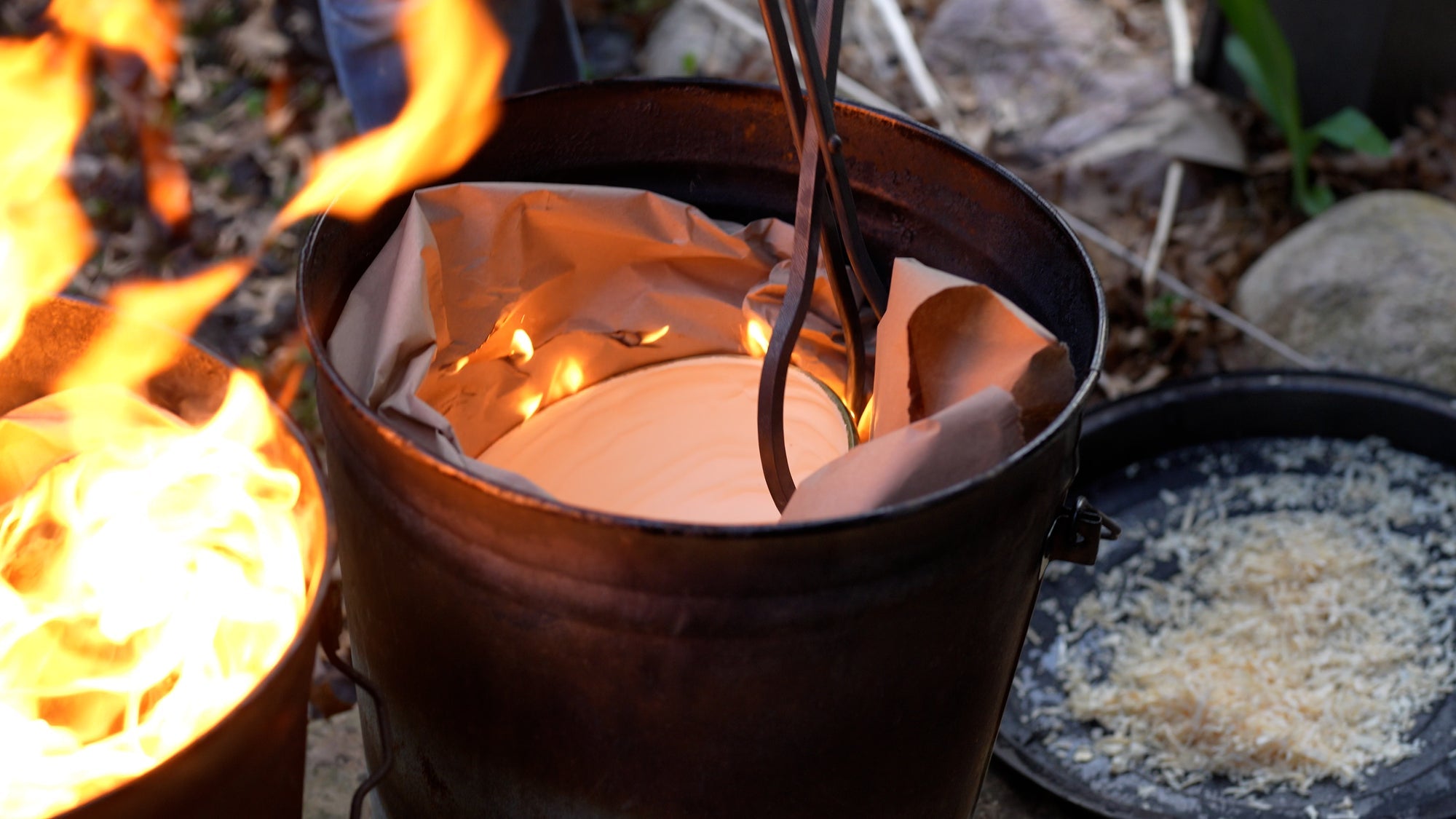 Hot ceramic entering a reduction chamber surrounded by flame