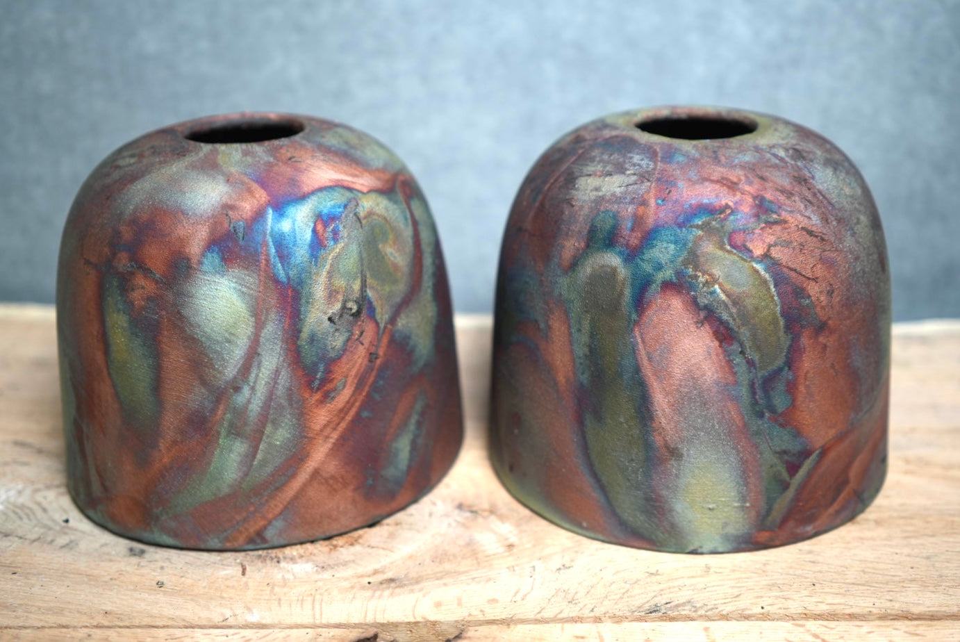Front view of two finished copper pendant shades